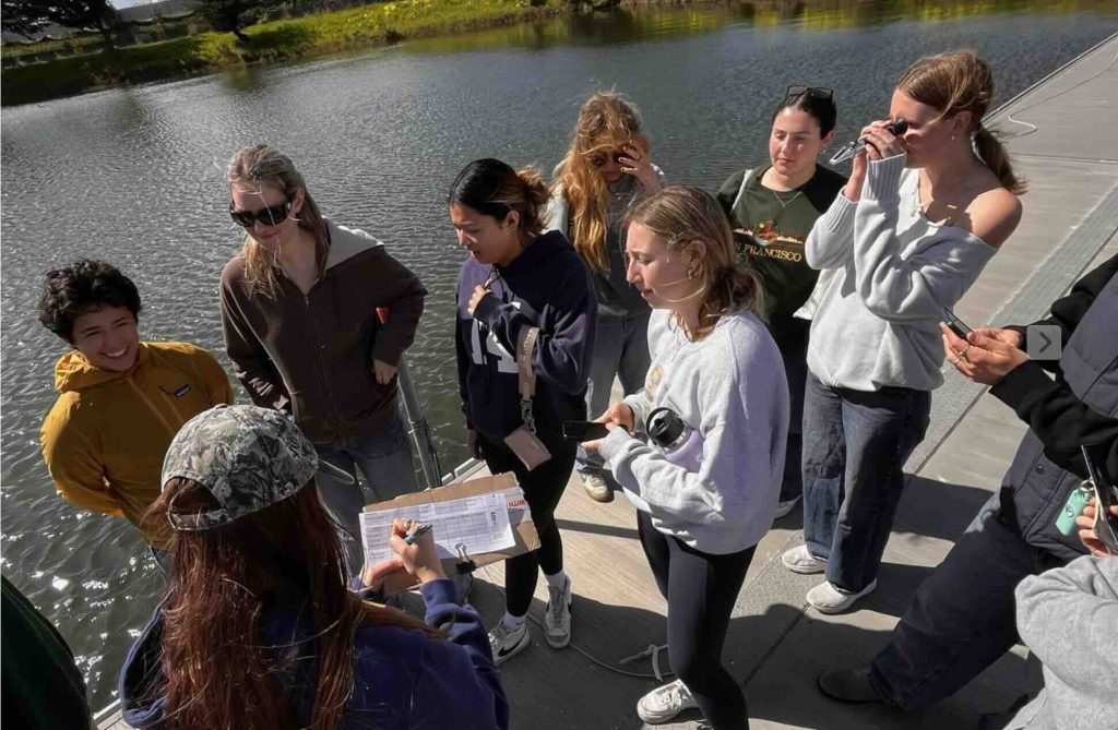 Group of kids sampling water